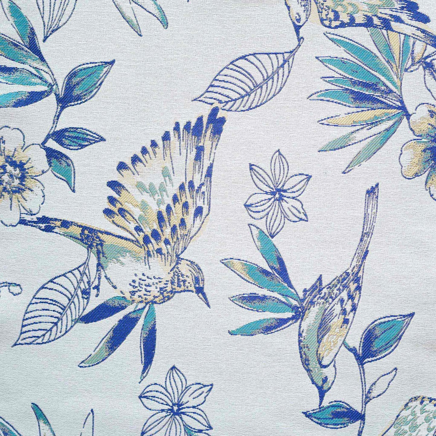 A charming white and blue cushion showcasing beautiful bird and floral patterns.