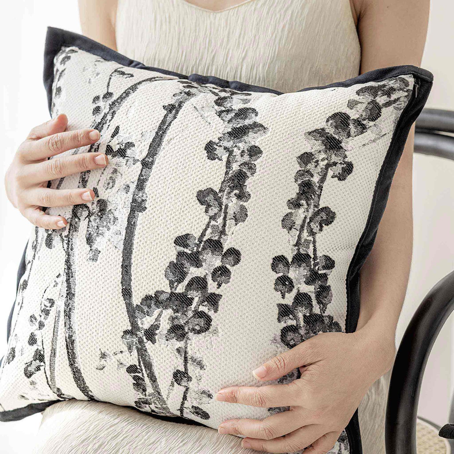 Delicate black and white vine jacquard with black wide edge cushion cover.