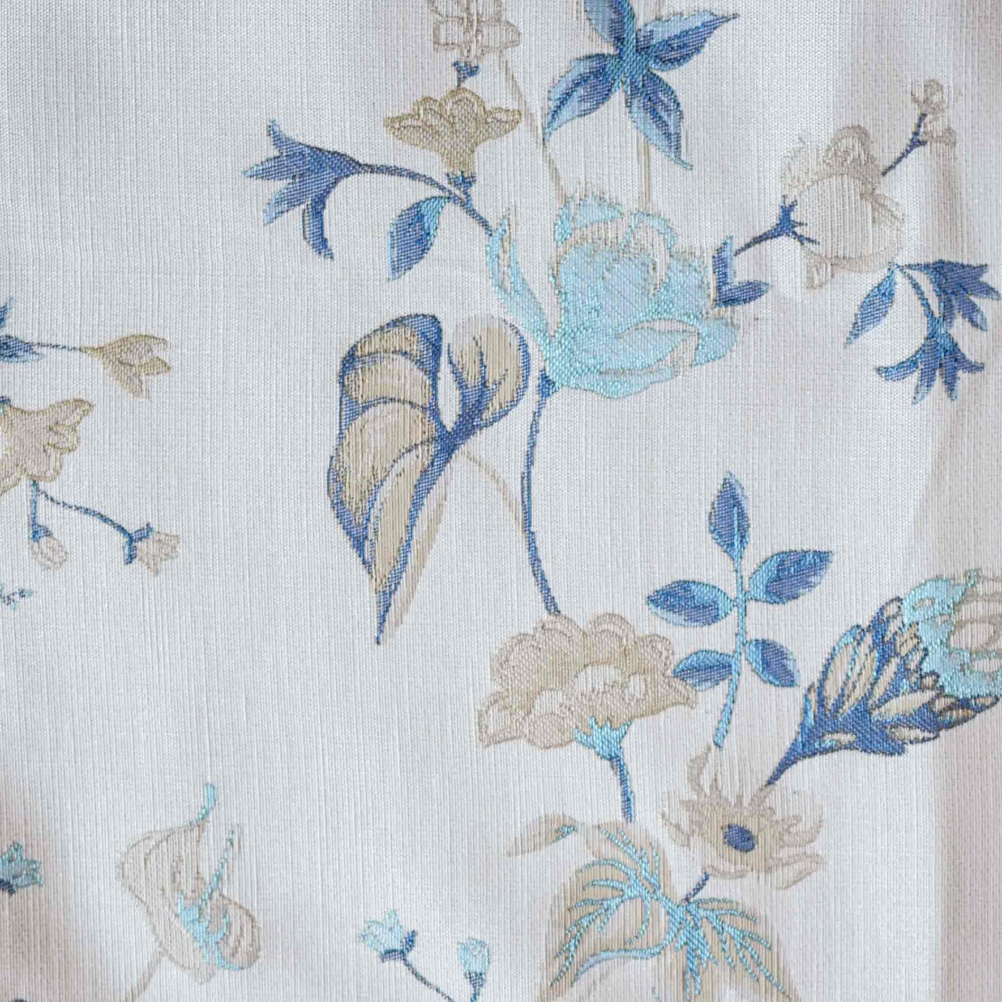 An elegance cushion cover adorned with a botanical floral design in blue and white with invisible zipper.