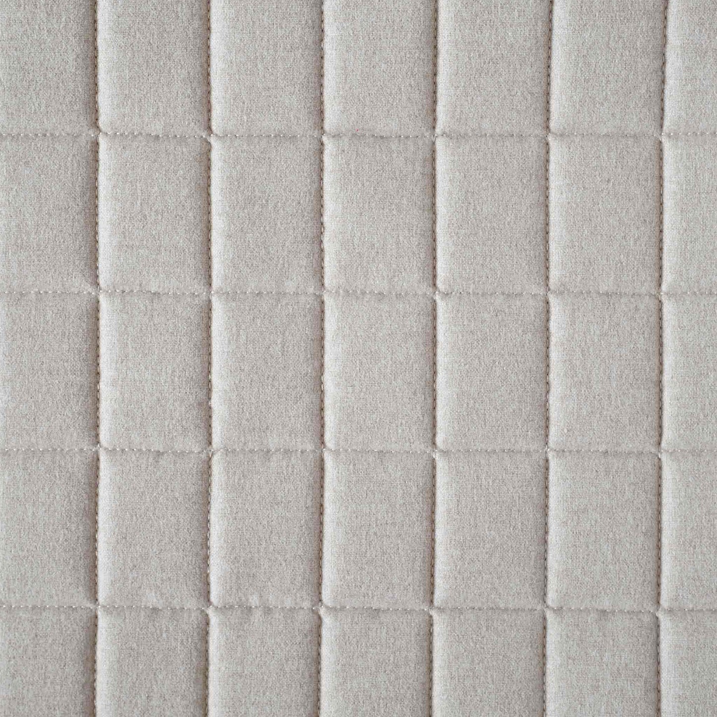 Soft beige quilted showcasing a geometric design cotton cushion cover.