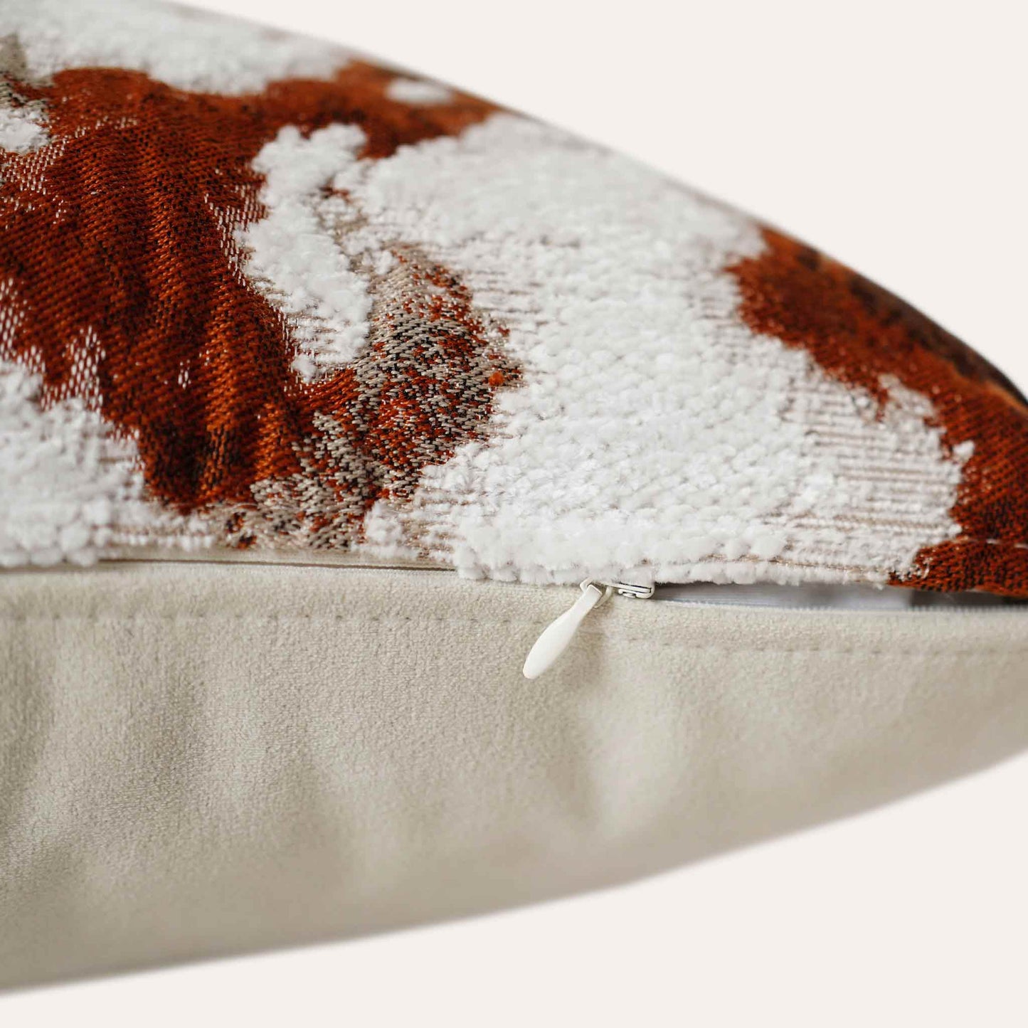 An attractive decor cushion cover adorned with red and white abstract floral with invisible zipper.