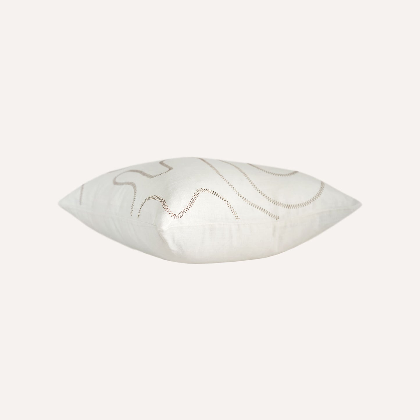 Ball stitch white background decorative cushion.