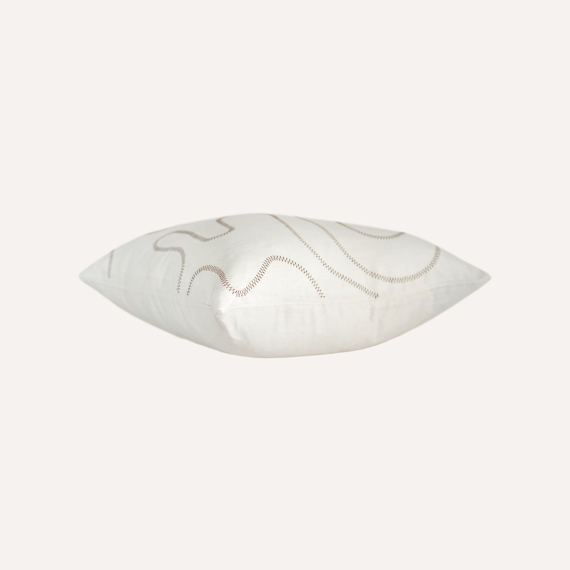 Ball stitch white background decorative cushion.