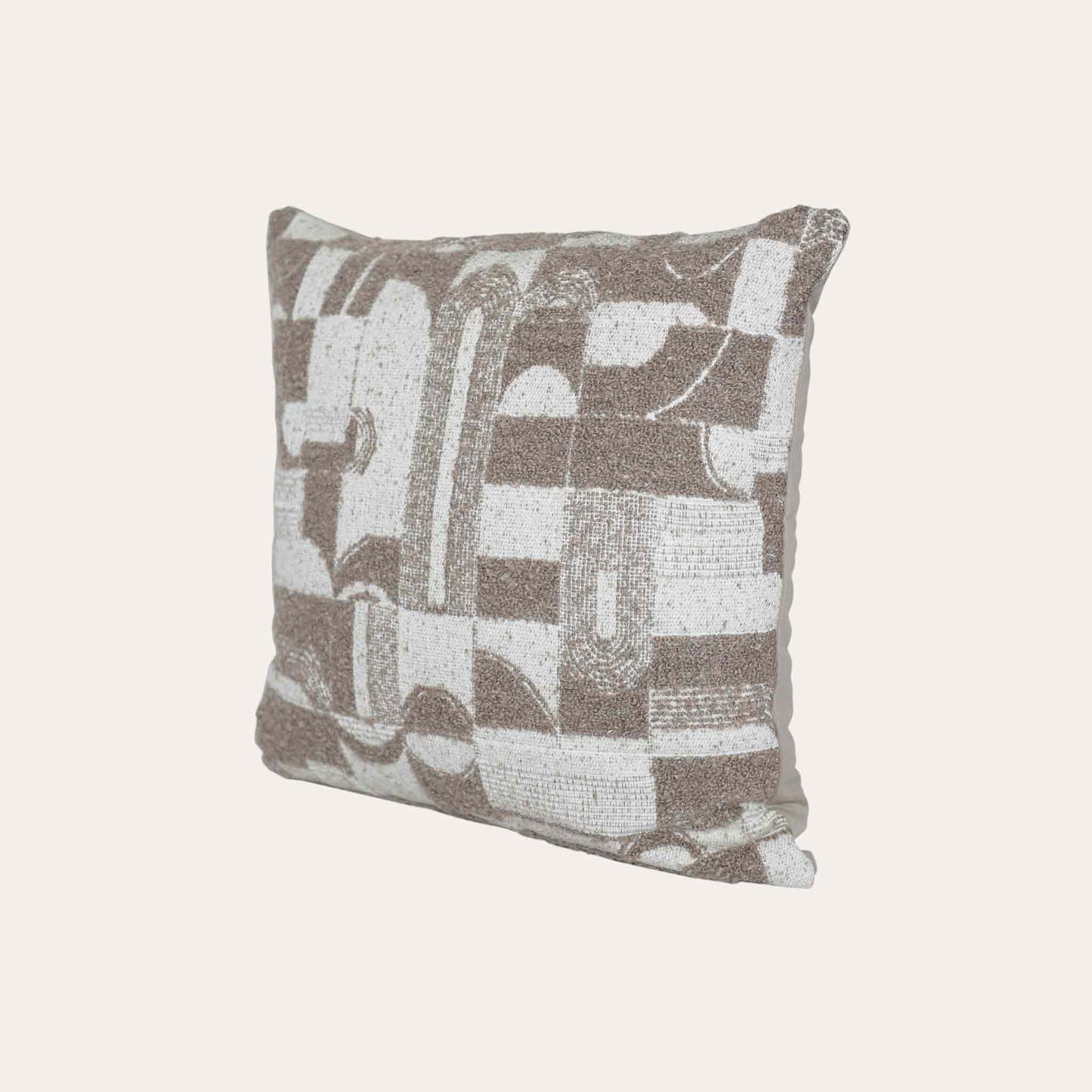 Trendy cushion cover with a chic geometric pattern in soft beige and white tones.