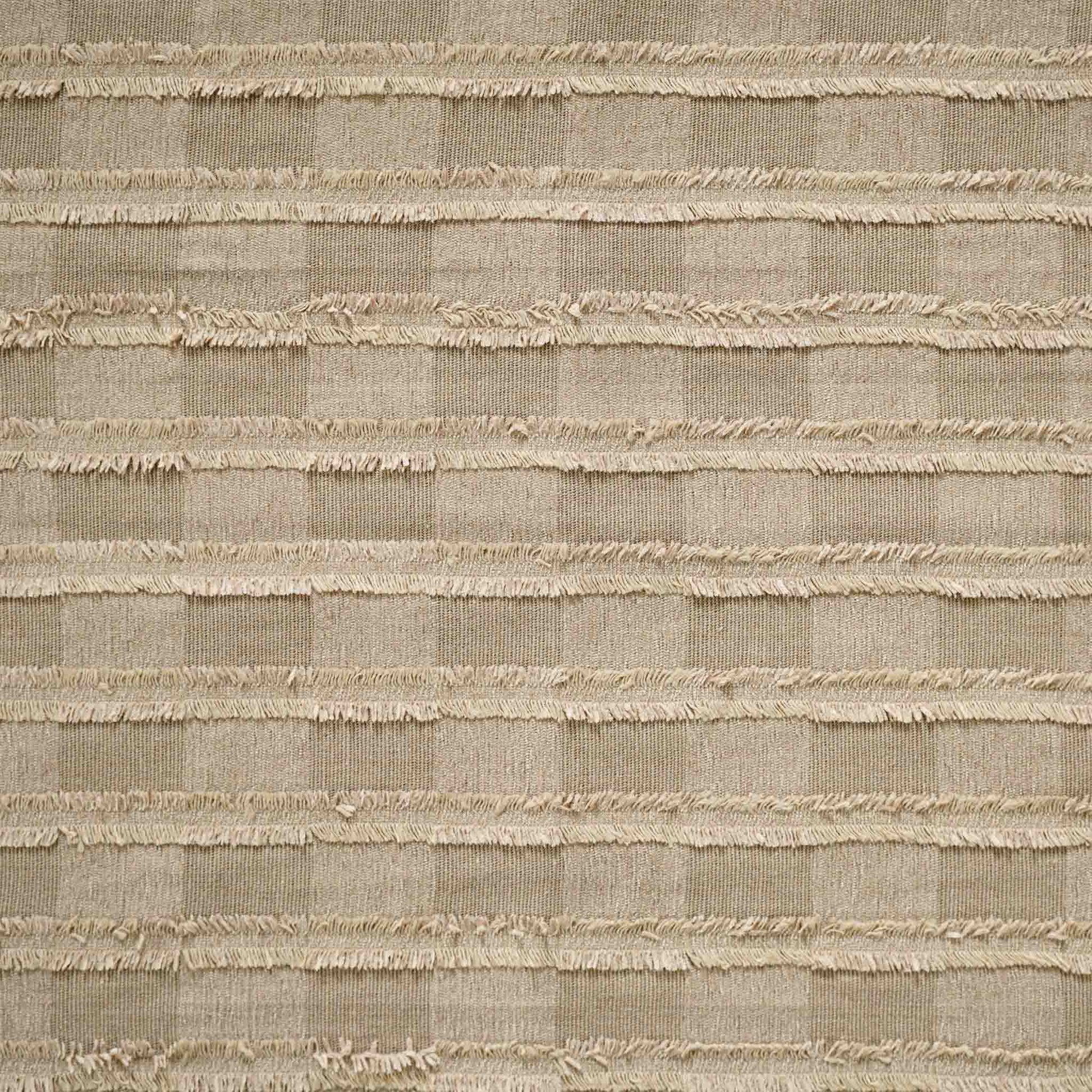 Square pattern cushion with textured design in earthy colour.