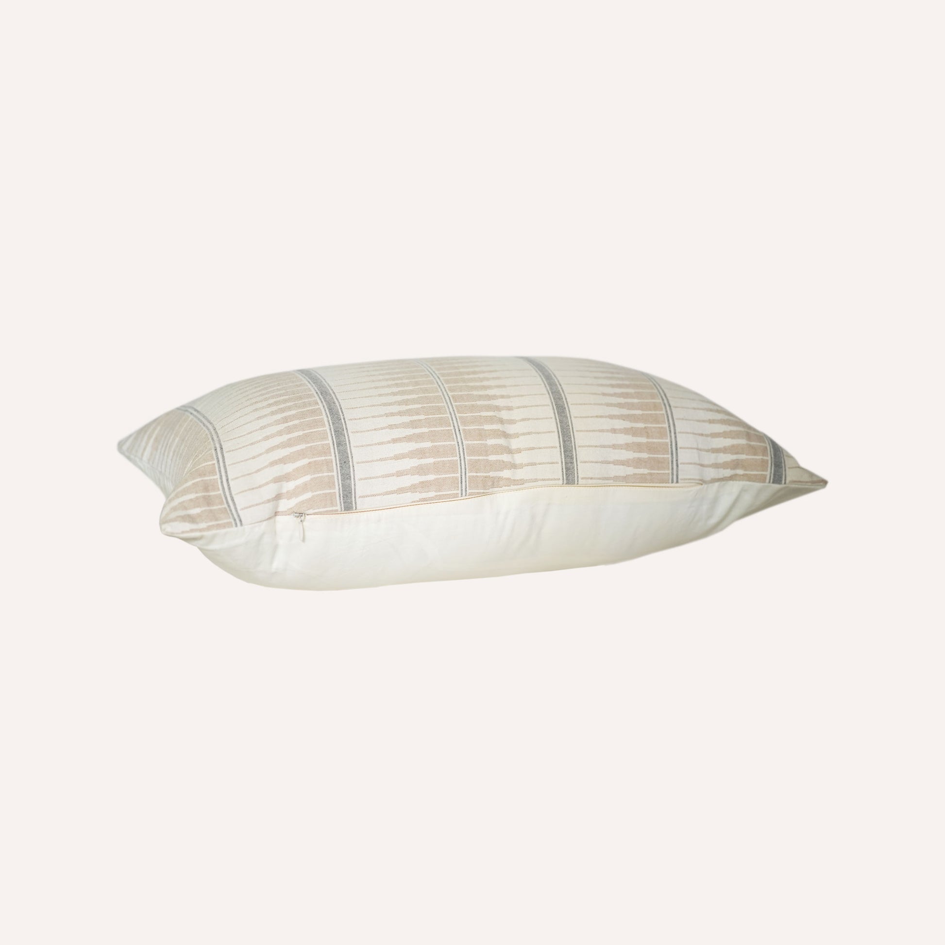 Grey and beige striped lumbar cushion have a subtle striped pattern.