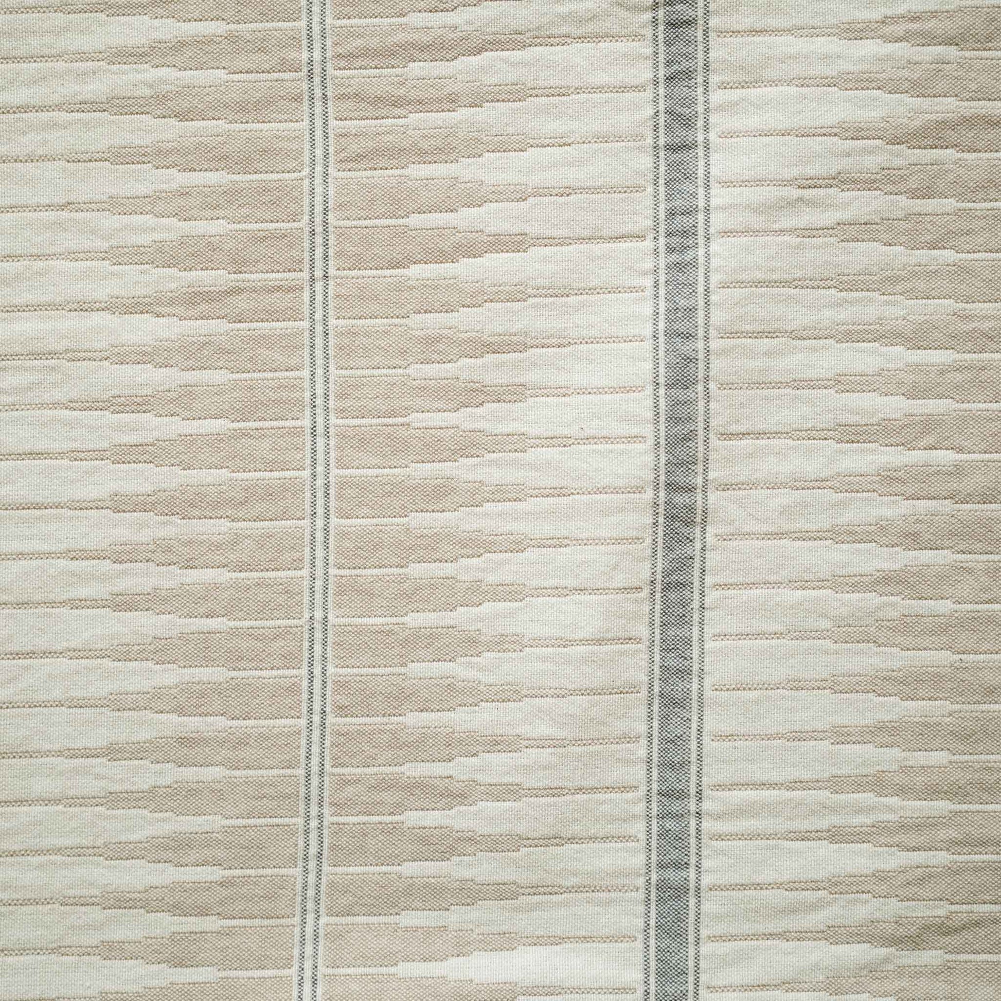 Grey and beige striped lumbar cushion have a subtle striped pattern.