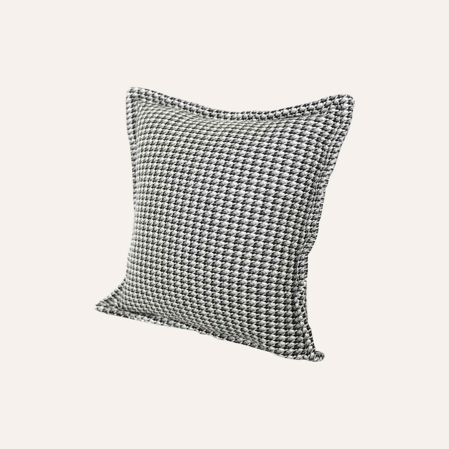 A black and grey checkered cushion cover featuring a houndstooth pattern with wide edges.