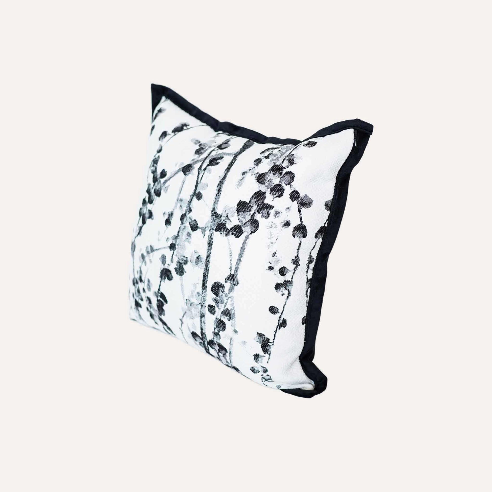Delicate black and white vine jacquard with black wide edge cushion cover.