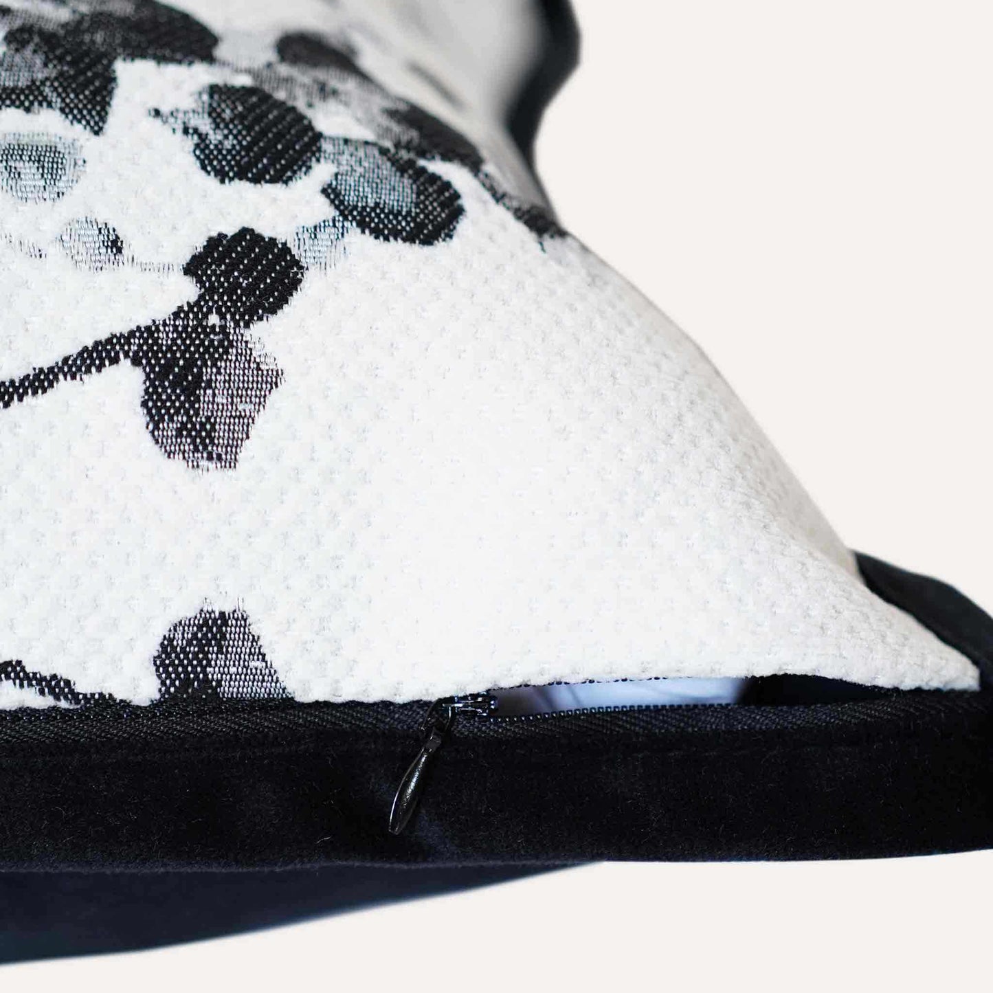 Delicate black and white vine jacquard with black wide edge cushion cover with invisible zipper.