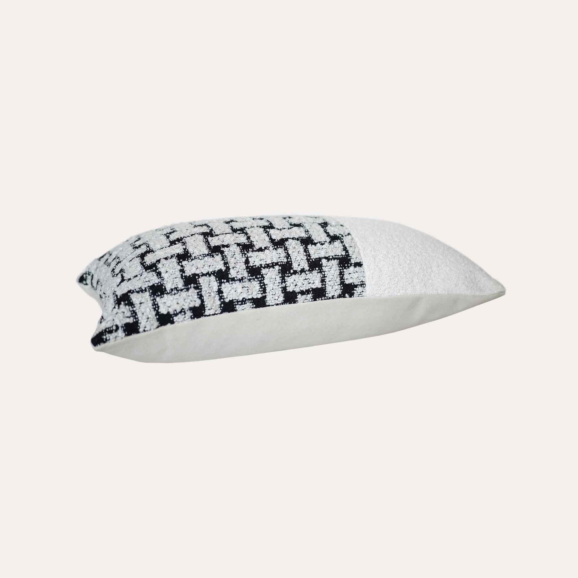 Black and white geometric brick chenille cushion cover.