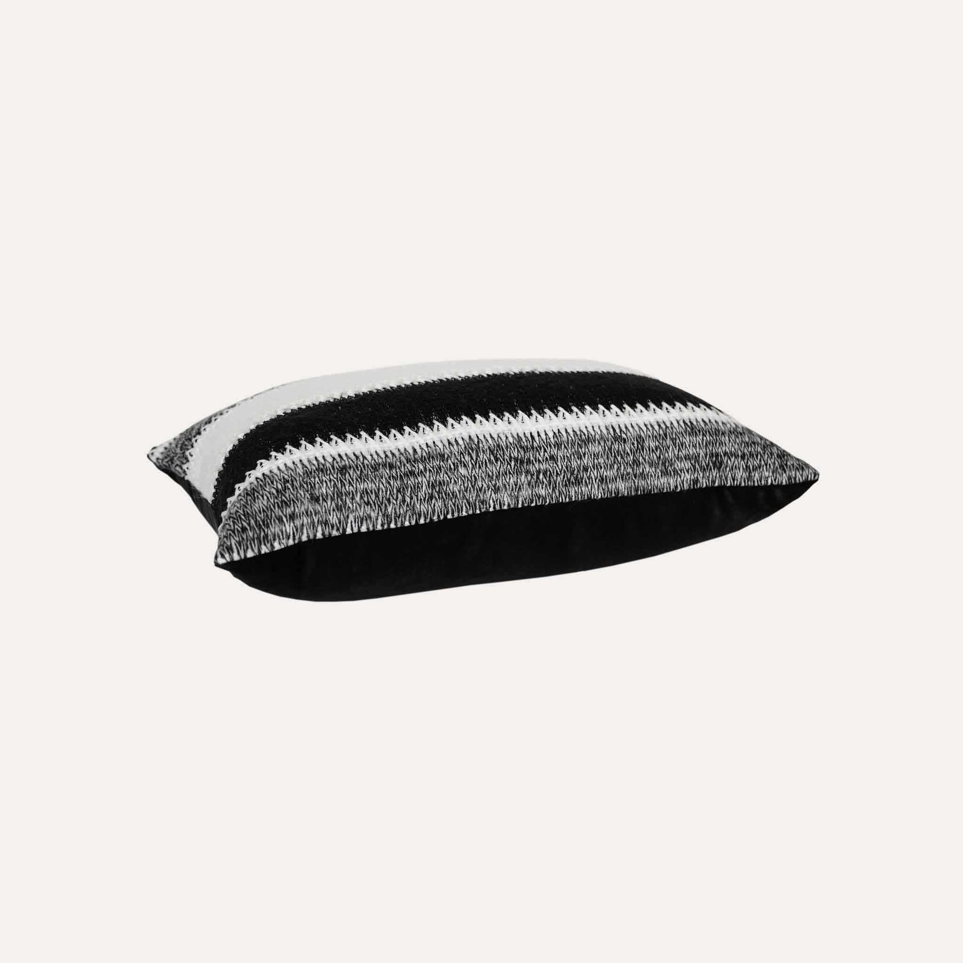Black and white striped woolen decorative cushion cover.