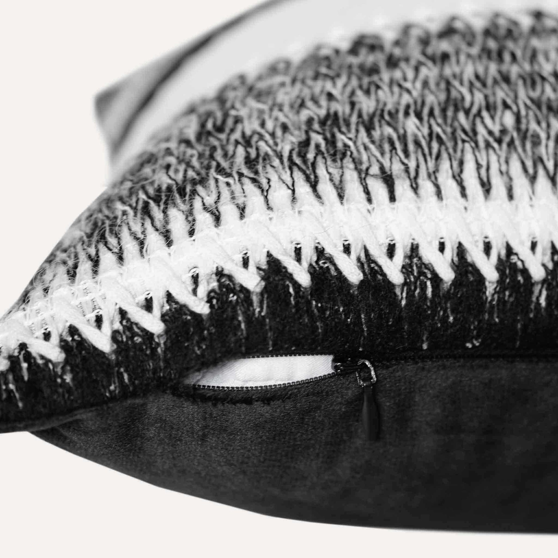 Black and white striped woolen decorative cushion cover with invisible zipper.