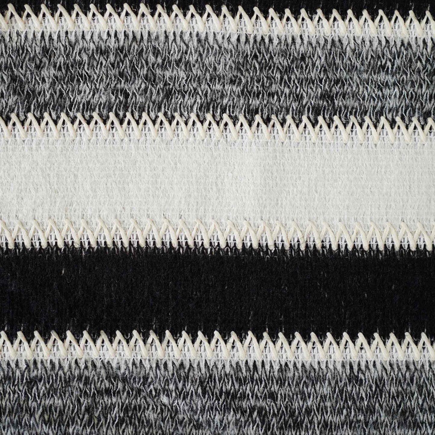 Black and white striped woolen decorative cushion cover.