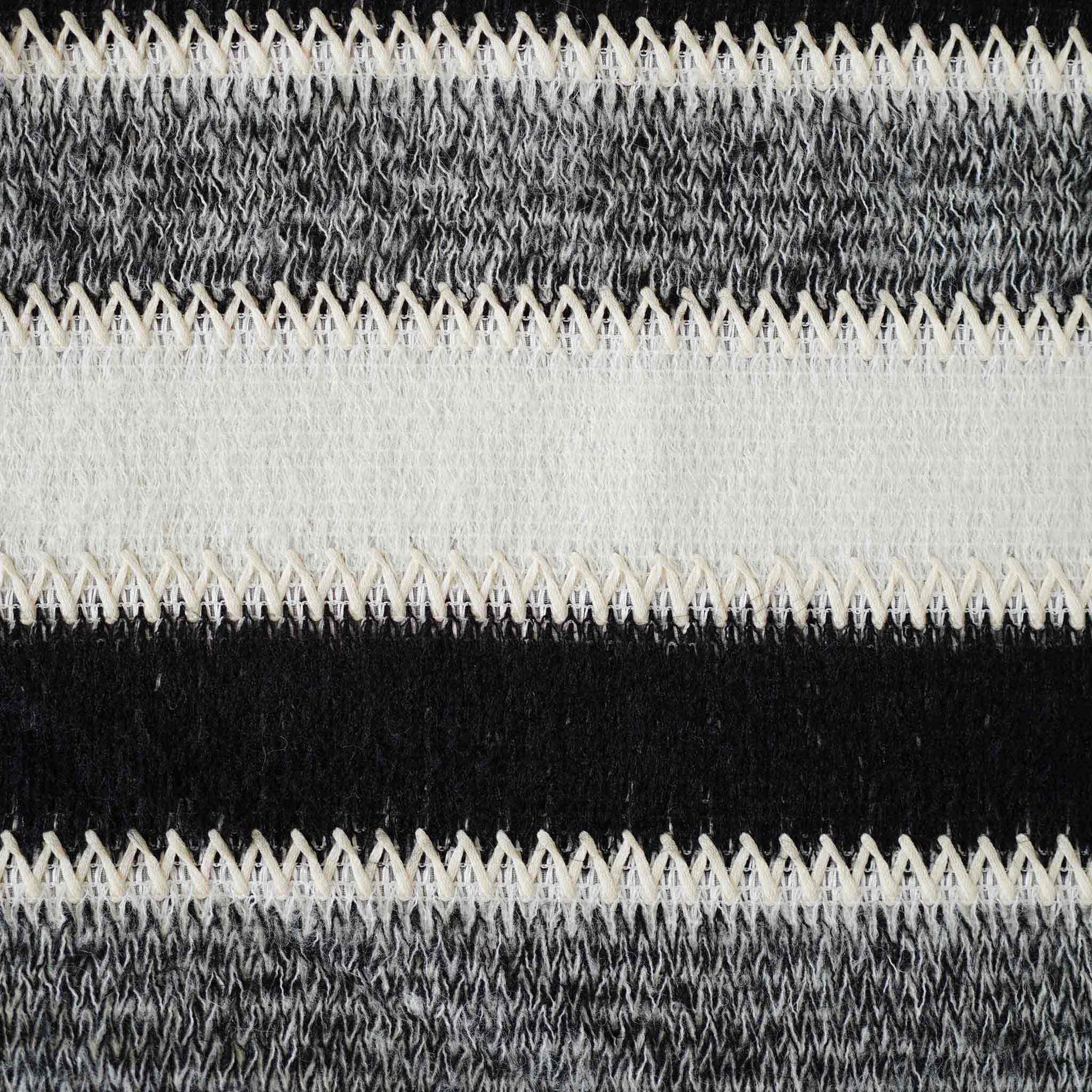 Black and white striped woolen decorative cushion cover.