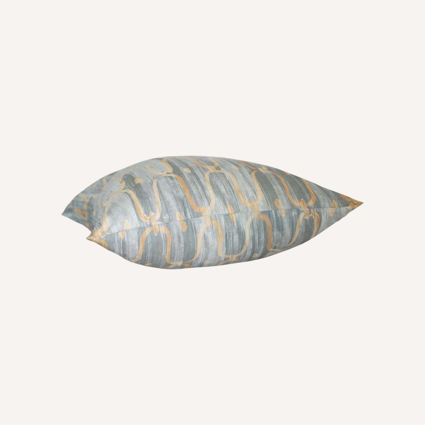 Decorative cushion in an elegant blue-grey and yellow pattern in a silk silky material.