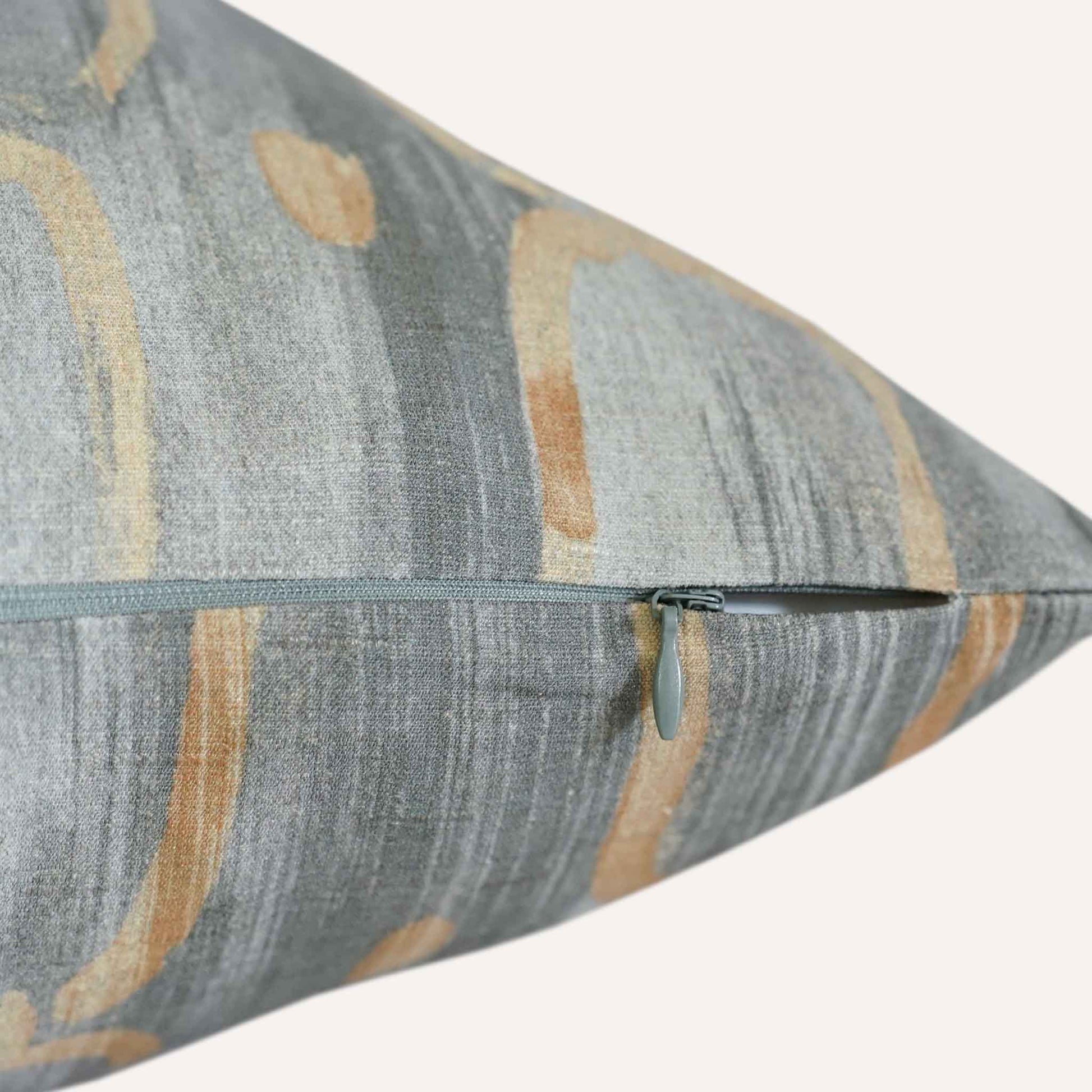 A side-zippered cushion, showcasing its functional design and soft fabric texture.