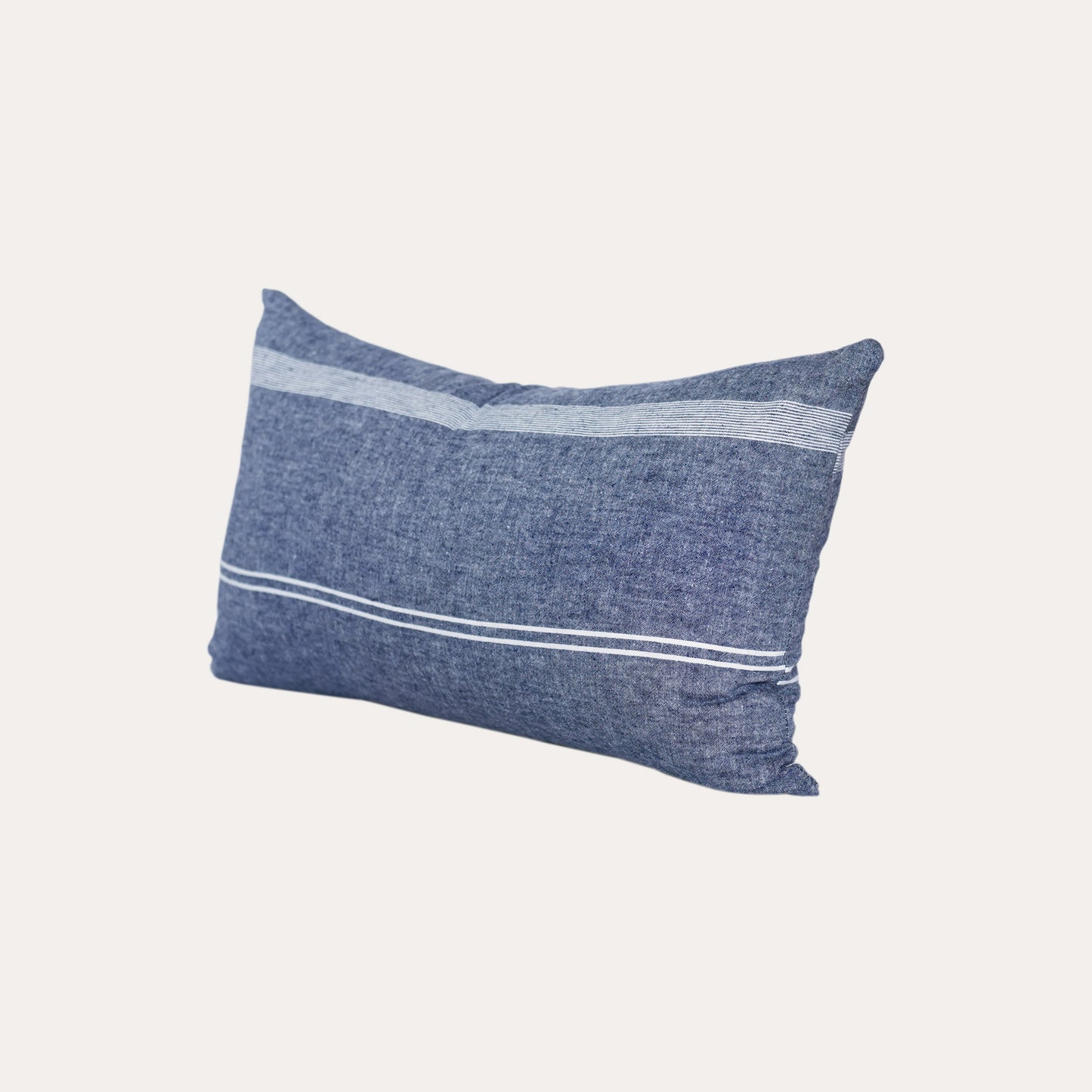 White stripe blue background lumbar cushion.