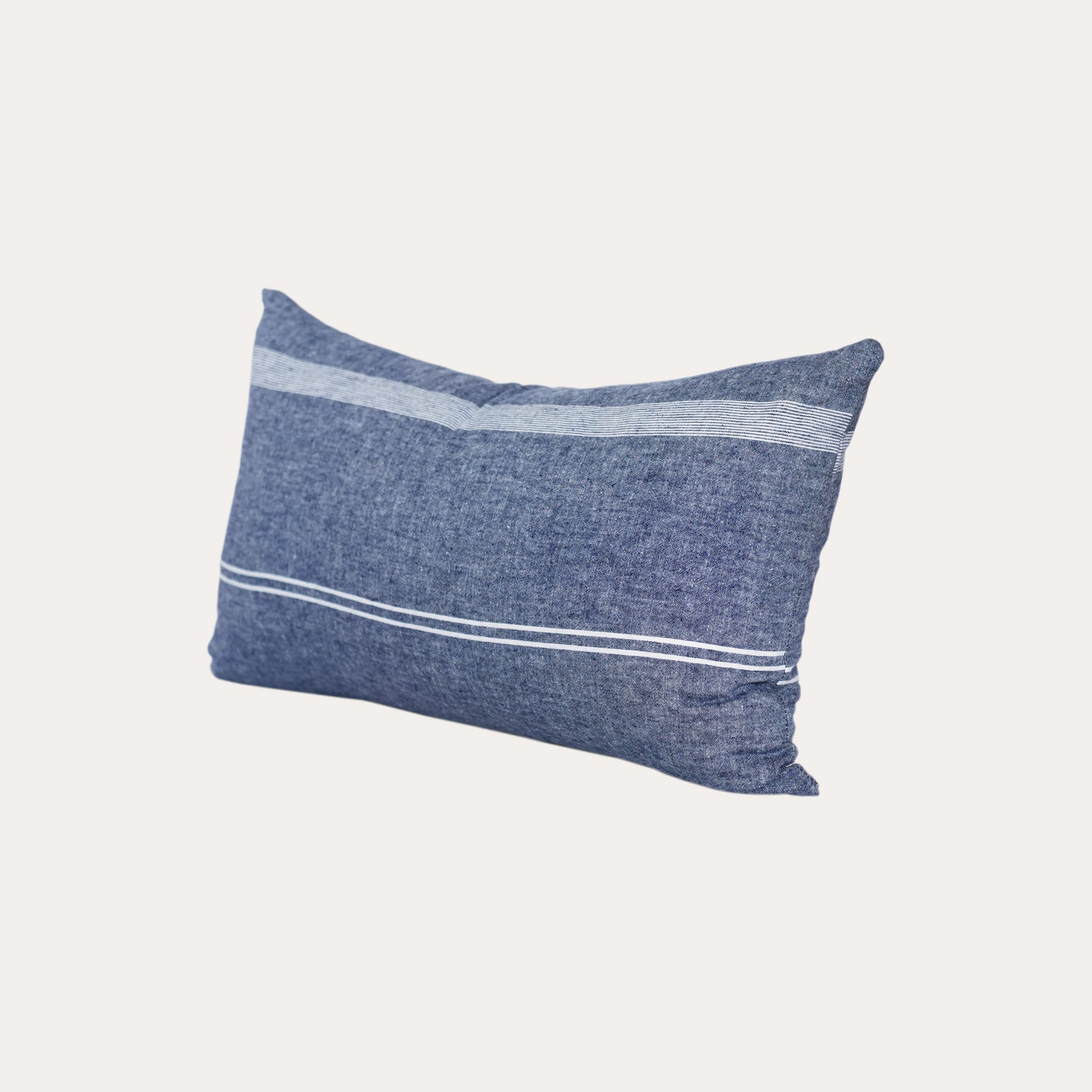 White stripe blue background lumbar cushion.