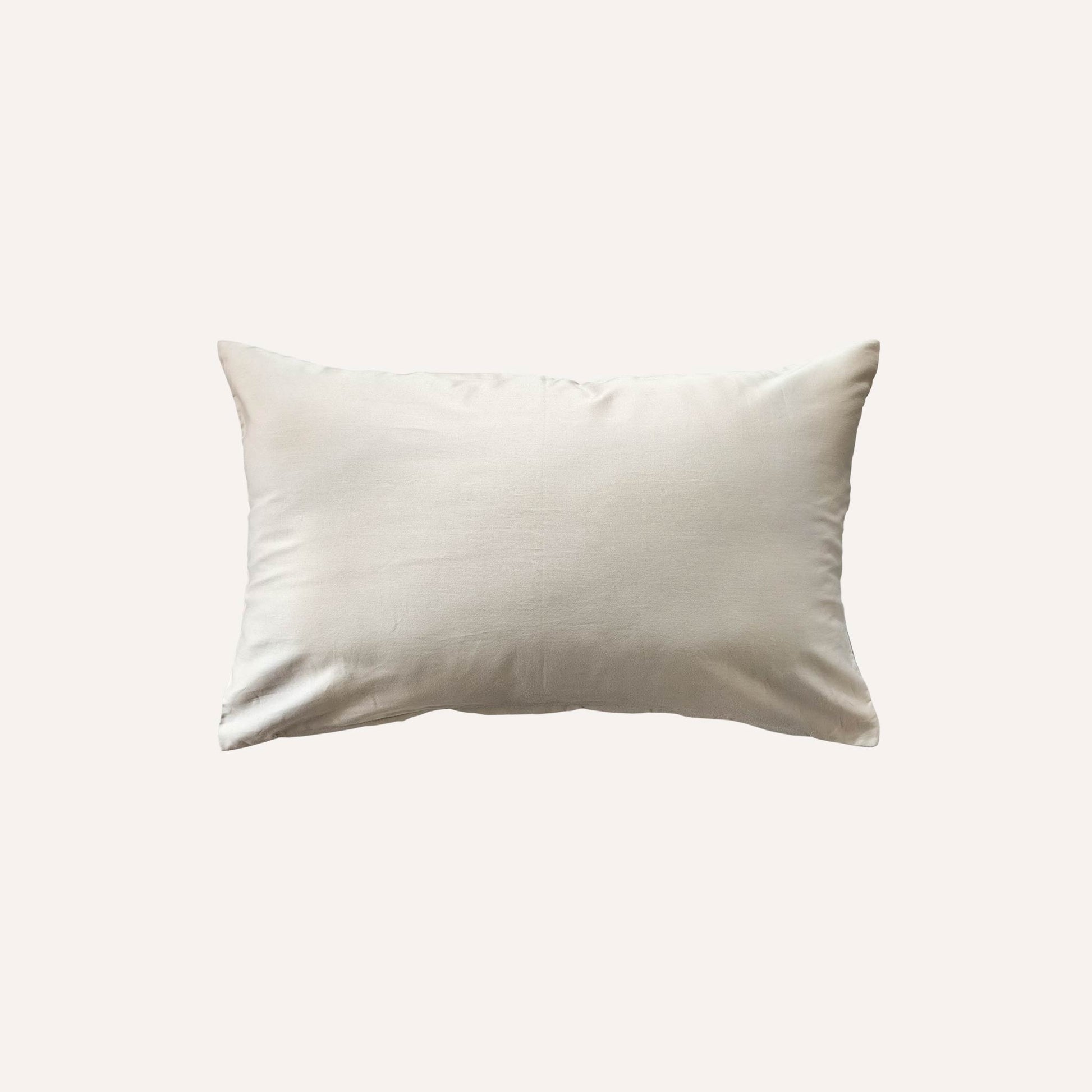 Solid beige base lumbar cushion back.