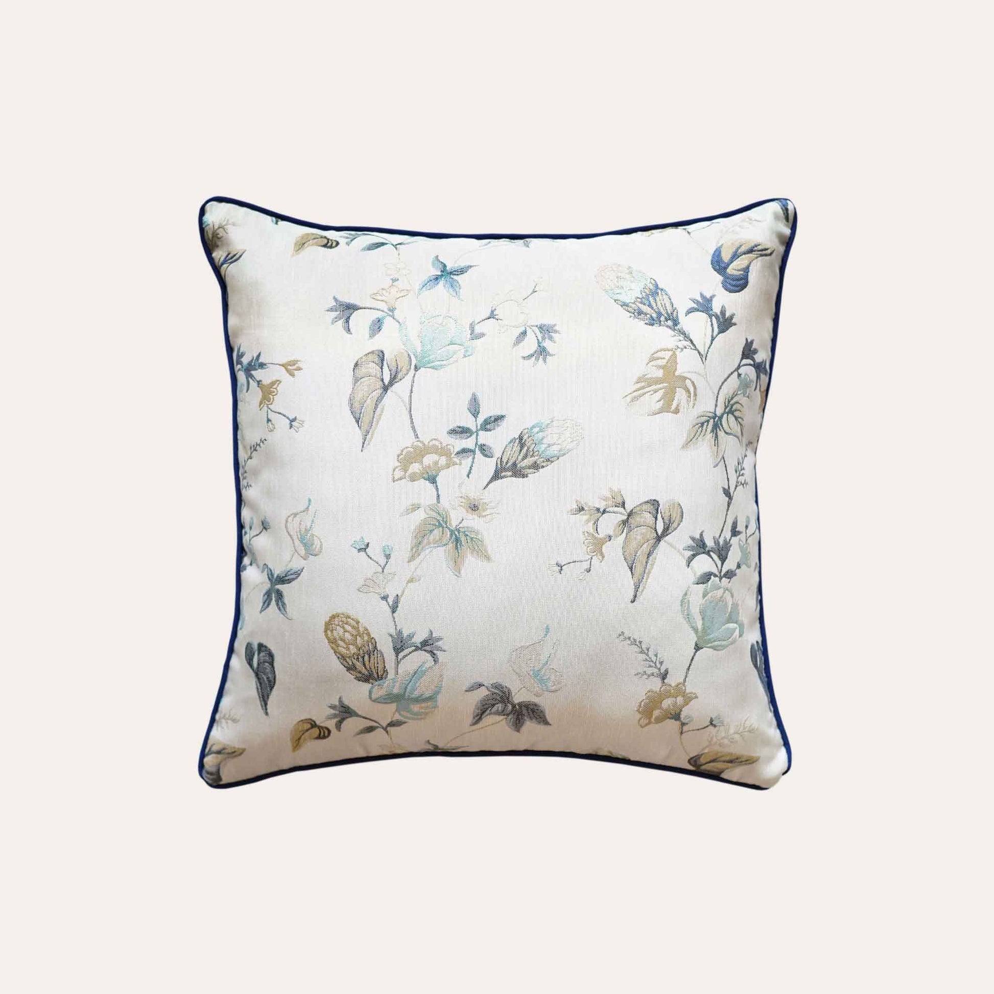 An elegance cushion cover adorned with a botanical floral design in blue and white.