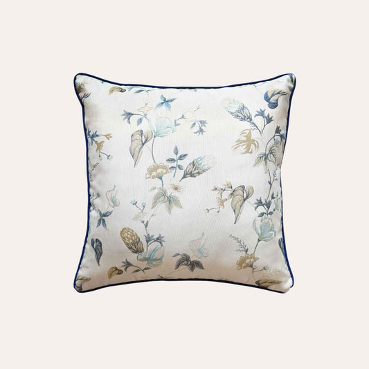 An elegance cushion cover adorned with a botanical floral design in blue and white.