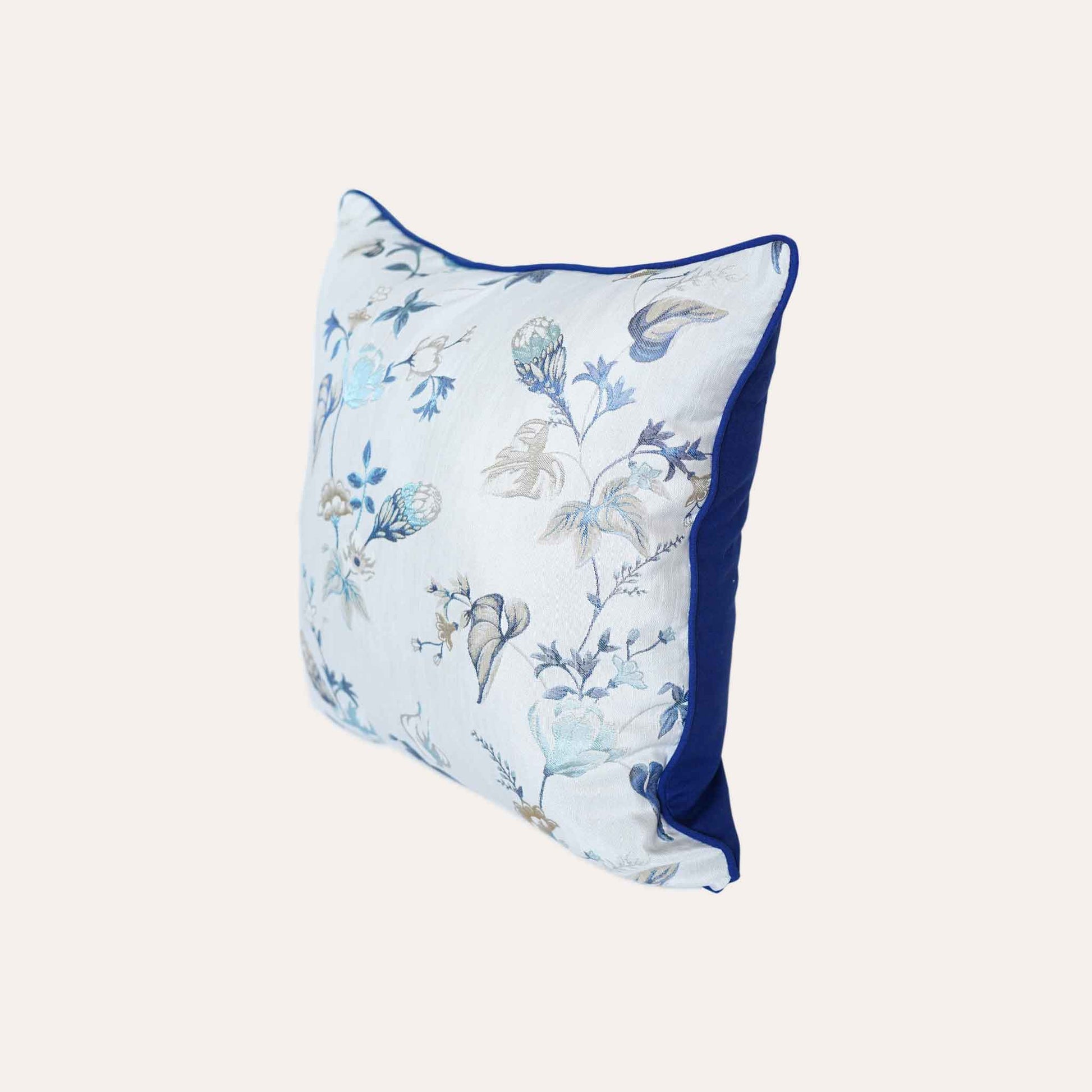 An elegance cushion cover adorned with a botanical floral design in blue and white with invisible zipper.