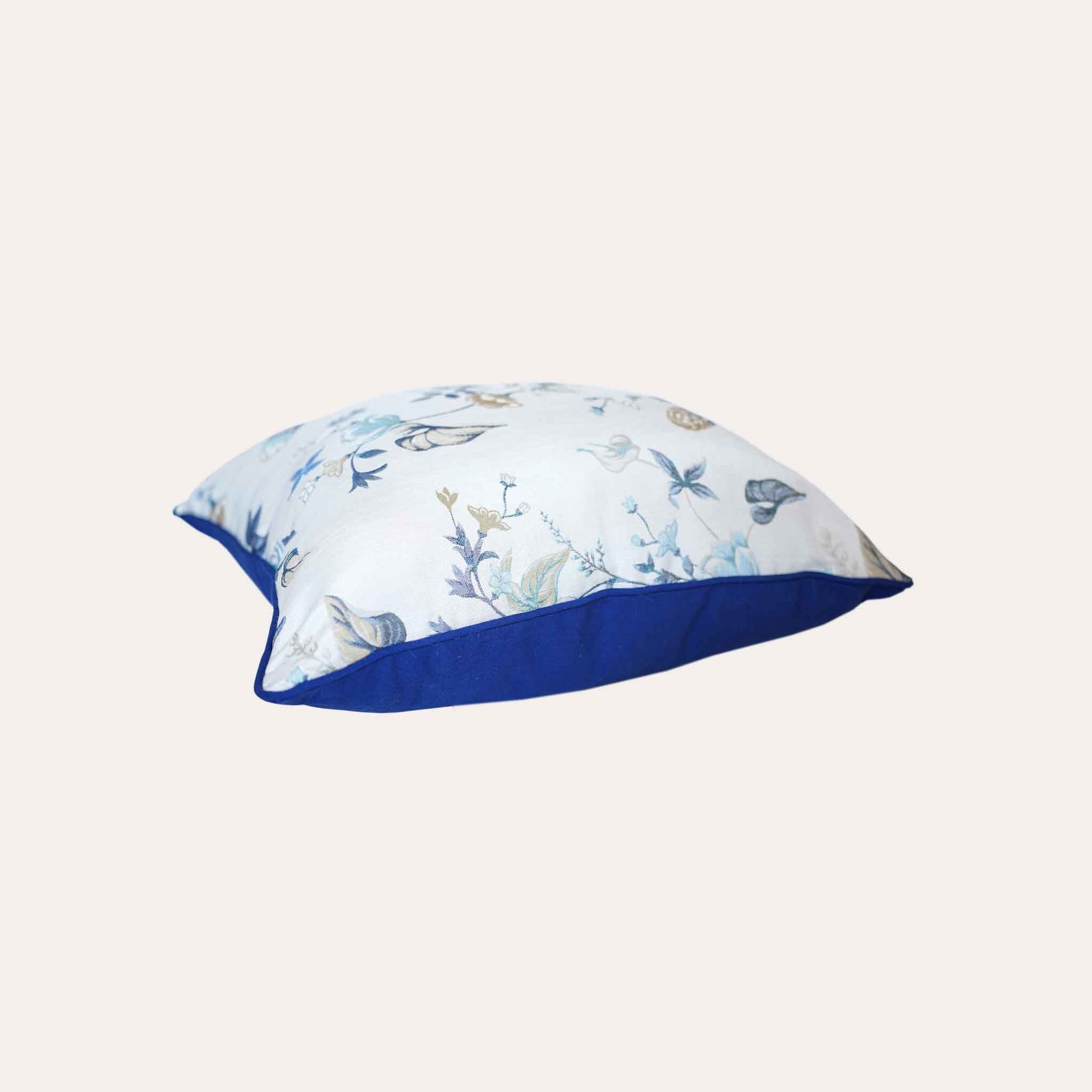 An elegance cushion cover adorned with a botanical floral design in blue and white with invisible zipper.