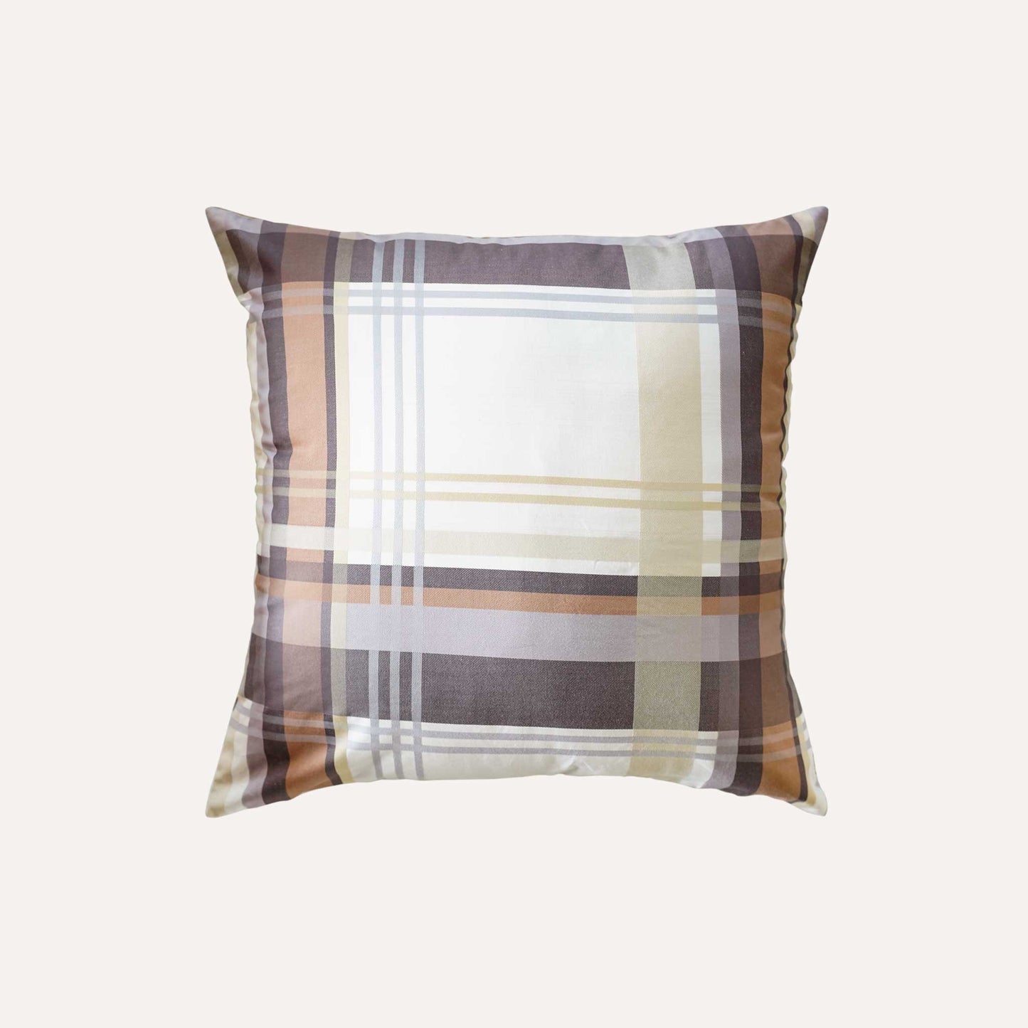Cushion featuring a classic plaid pattern in shades of brown, grey, and white.