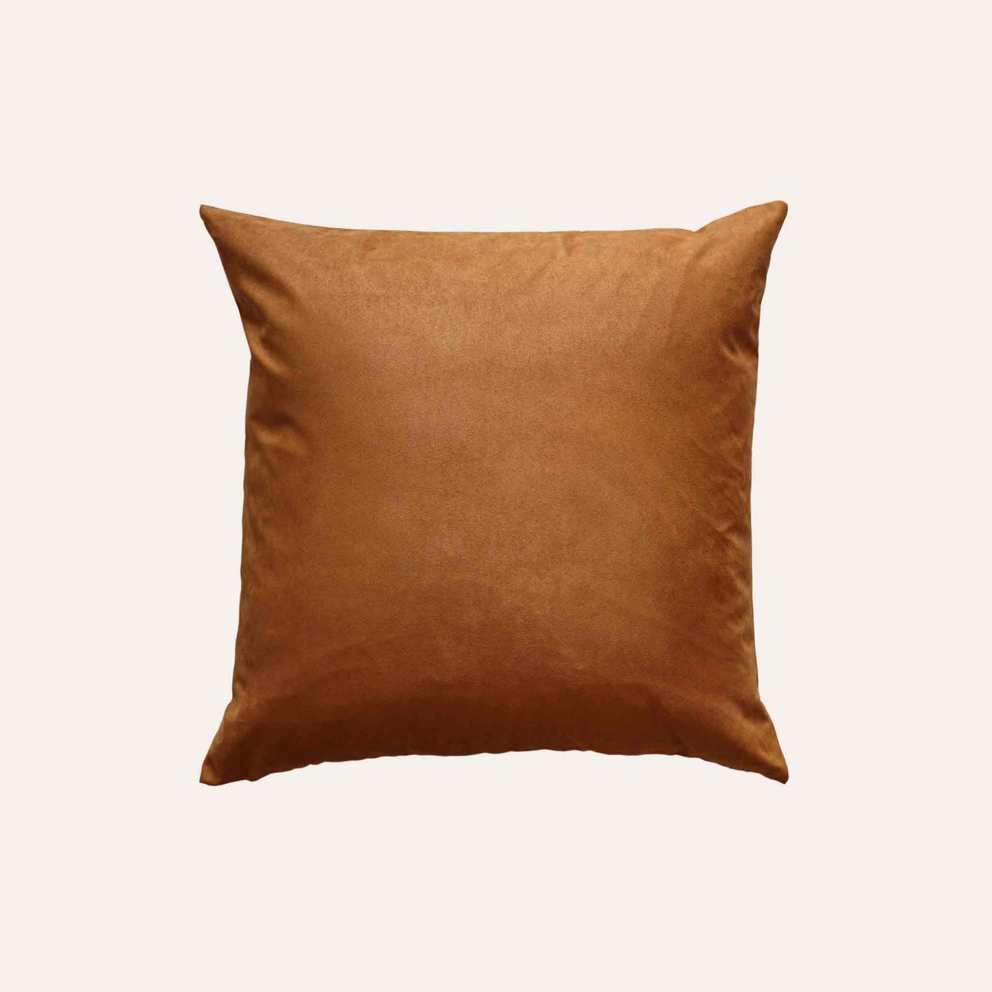 Soft texture and stylish design of solid tan suede cushion cover.