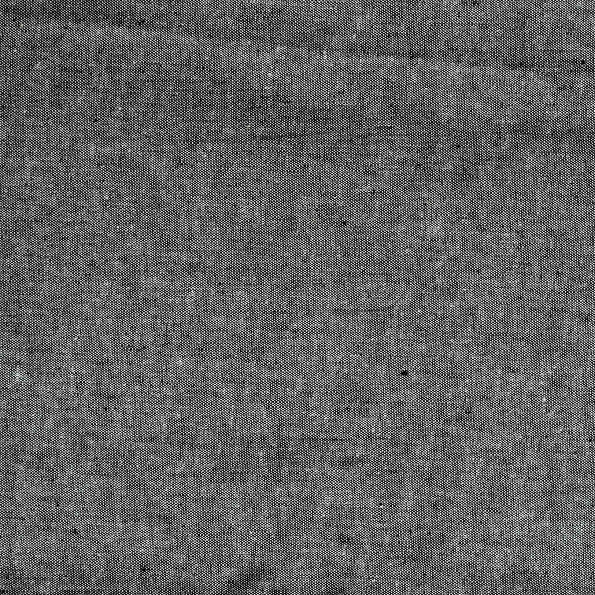 Dark Gray cushion with black fringes, adding a stylish touch to home decor.