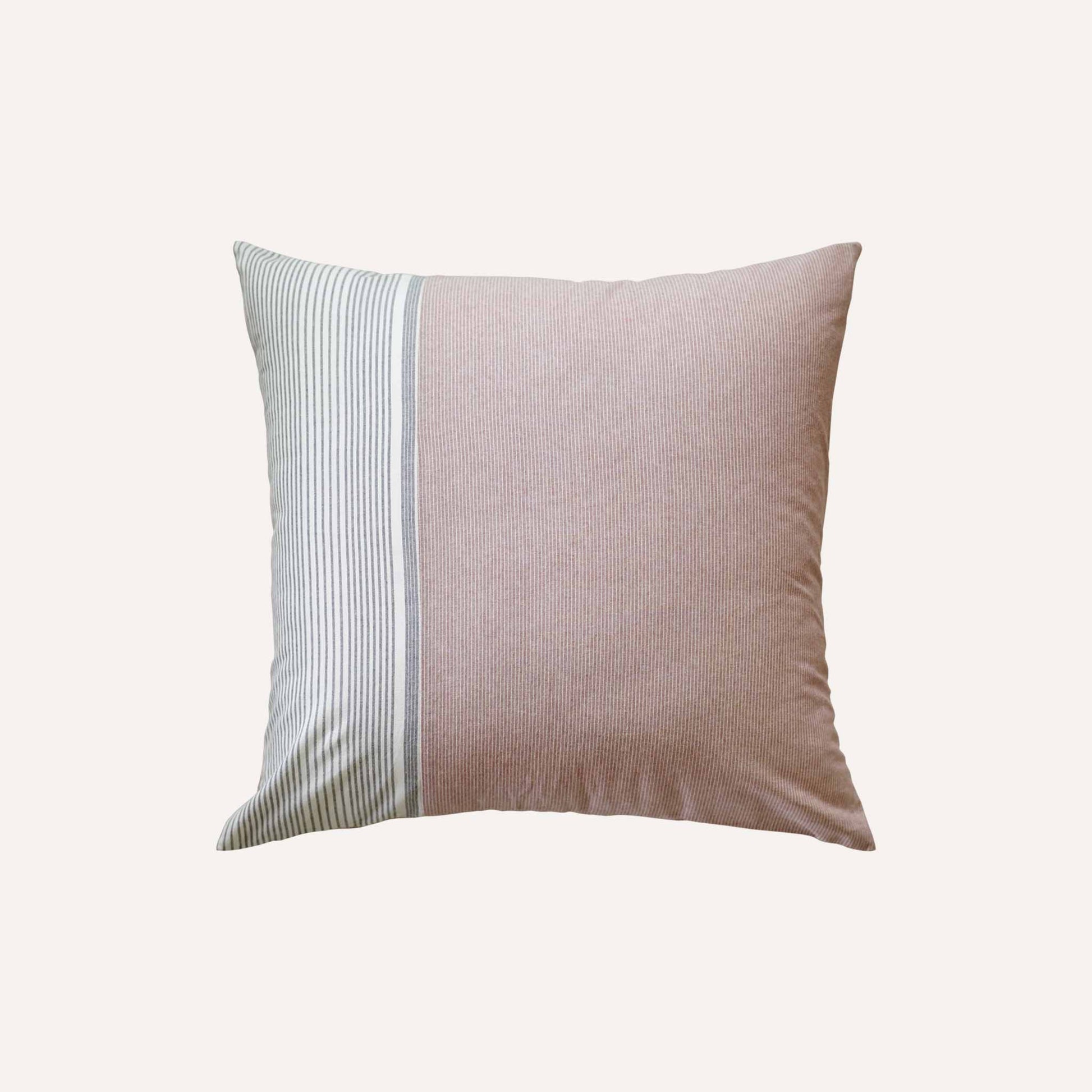 The coral red, white and grey stripe asymmetric cushion adds vibrancy to any decor.