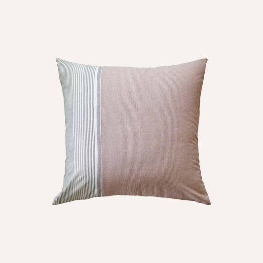 The coral red, white and grey stripe asymmetric cushion adds vibrancy to any decor.