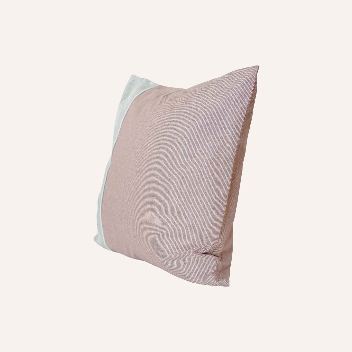 The coral red, white and grey stripe asymmetric cushion adds vibrancy to any decor.