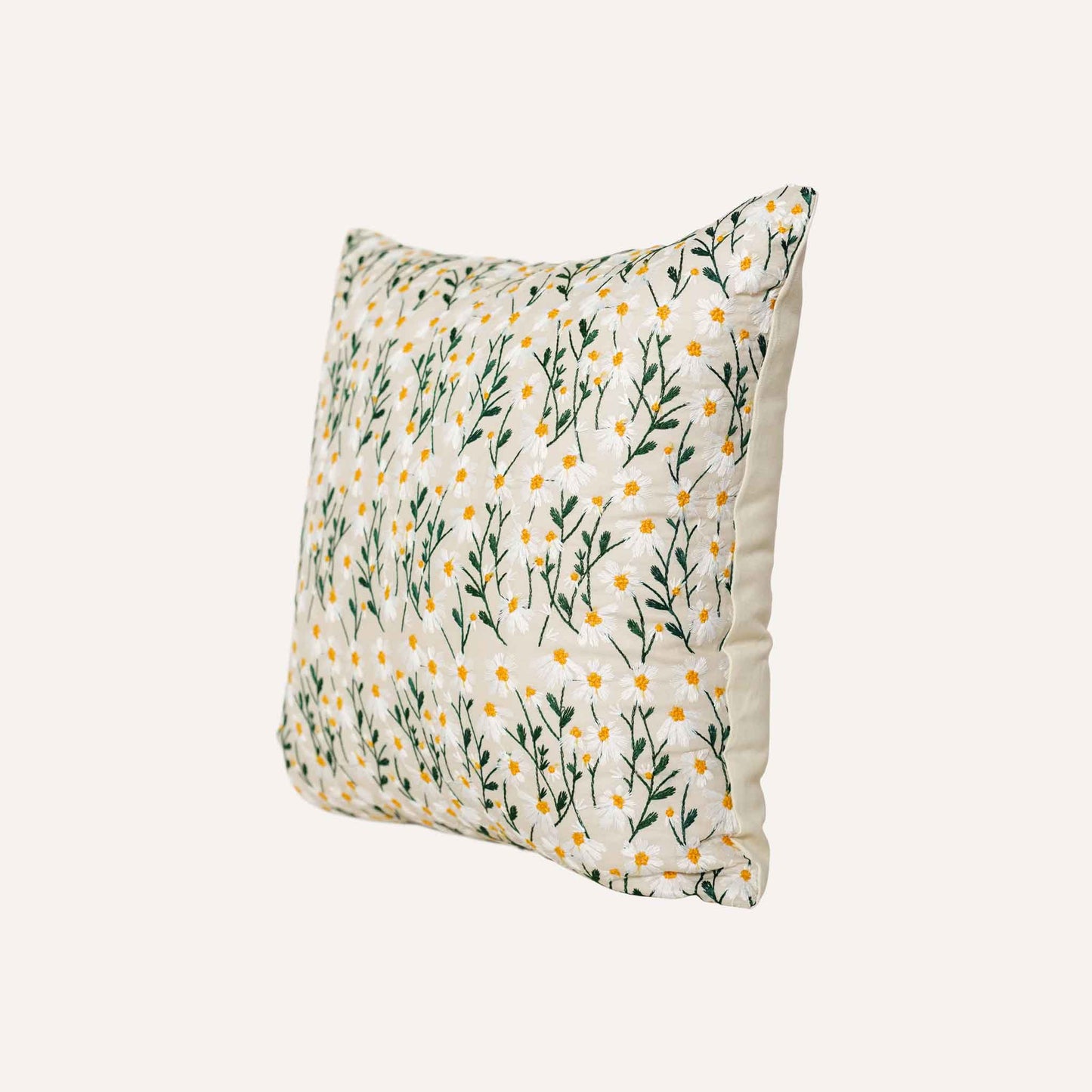 Tiny daisy pattern embroidered beige background cushion.
