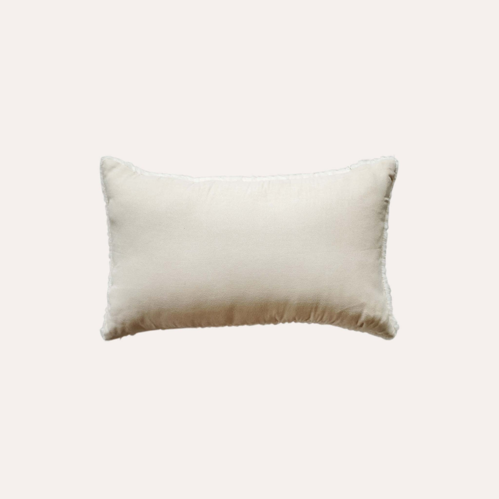 White wave cut faux fur lumbar cushion cover with white back.
