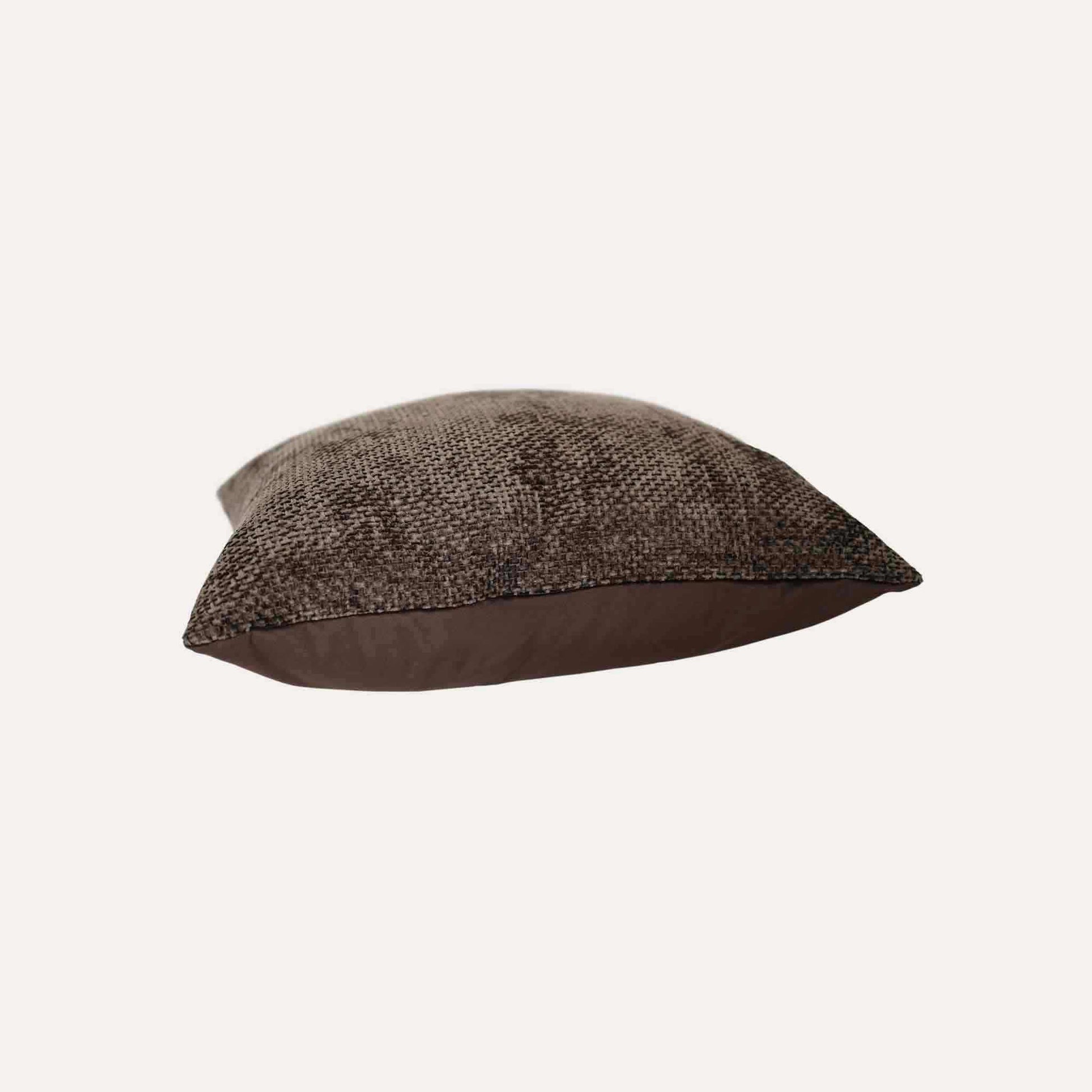 Cushion cover in a rich dark brown hue, expertly made from intricately woven chenille fabric.