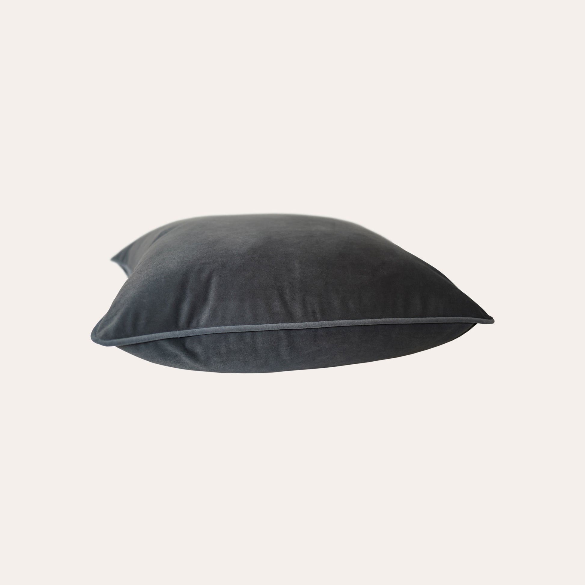 Soft dark grey velvet with stylish piping cushion cover.