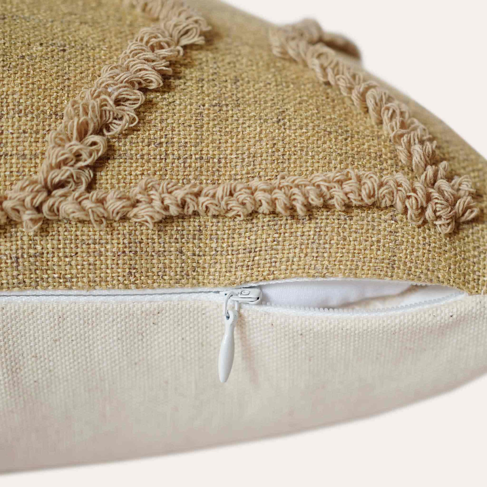 Earth-yellow embroidered diamond pattern cotton cushion cover with invisible zipper.