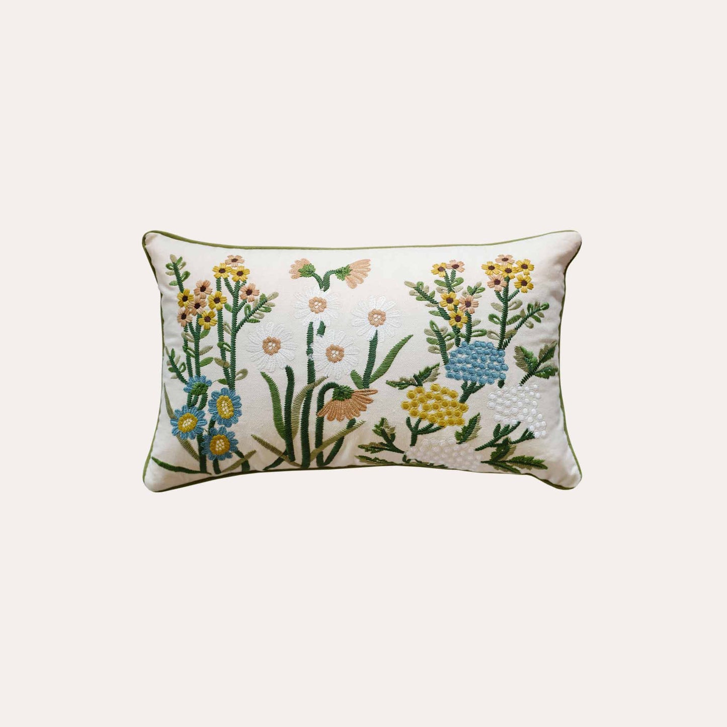 Decorative cushion cover with colorful embroidered floral pattern on a white background.