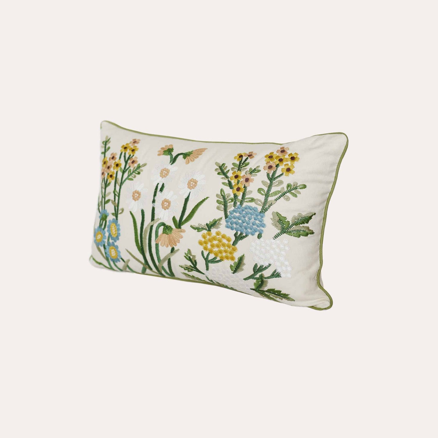 Decorative cushion cover with colorful embroidered floral pattern on a white background.
