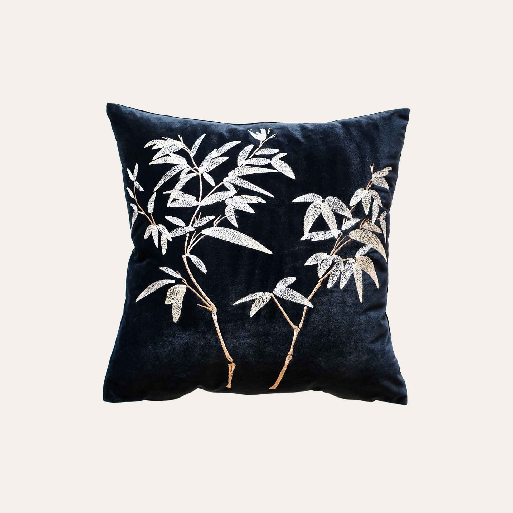 Elegant gold bamboo embroidered cushion cover with black background.