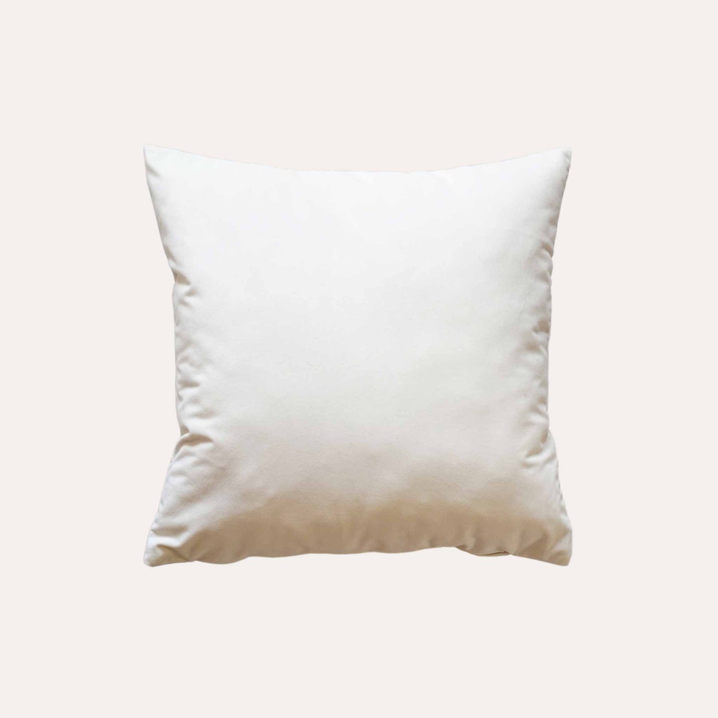 Elegant gold bamboo embroidered cushion with white background.