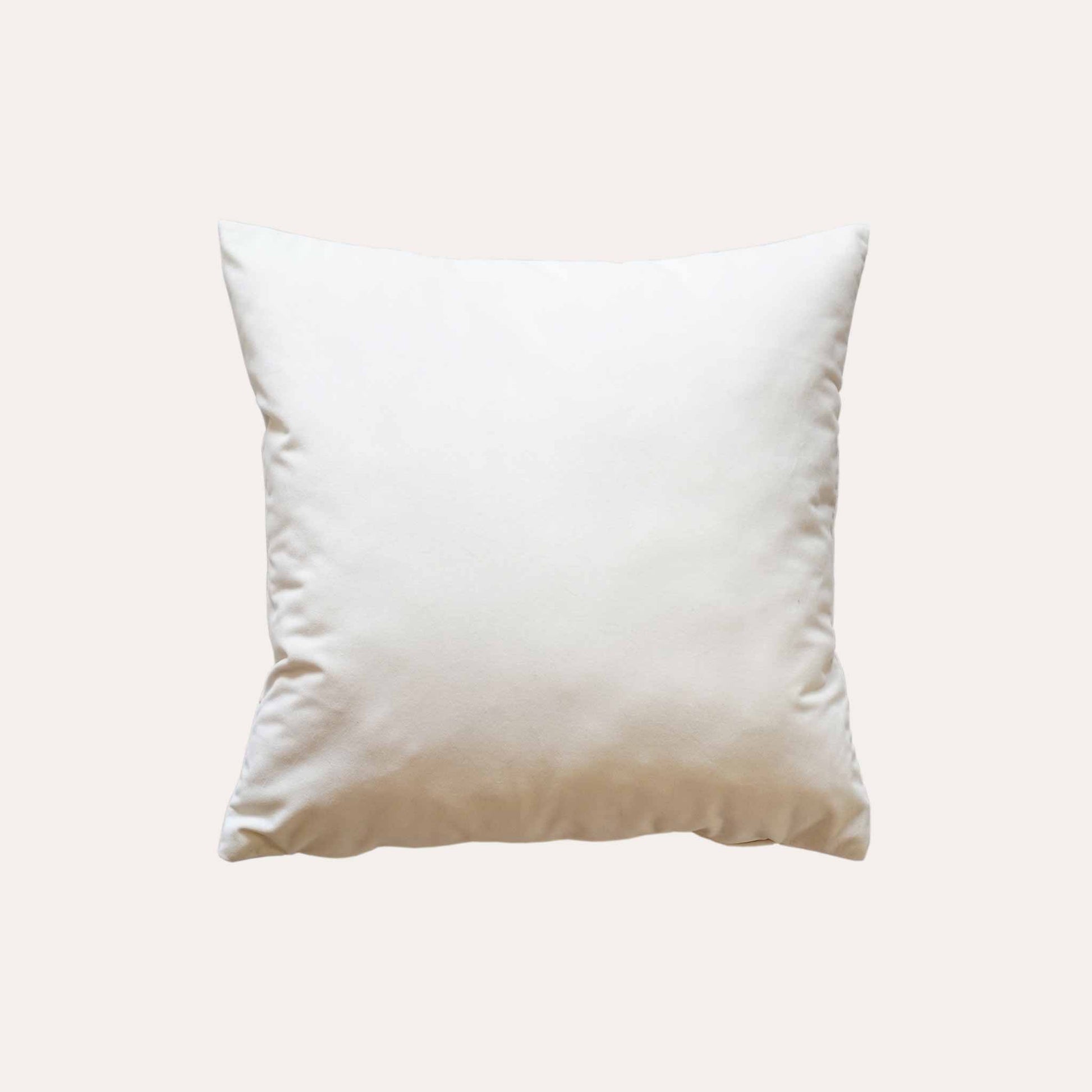 Elegant gold bamboo embroidered cushion with white background.