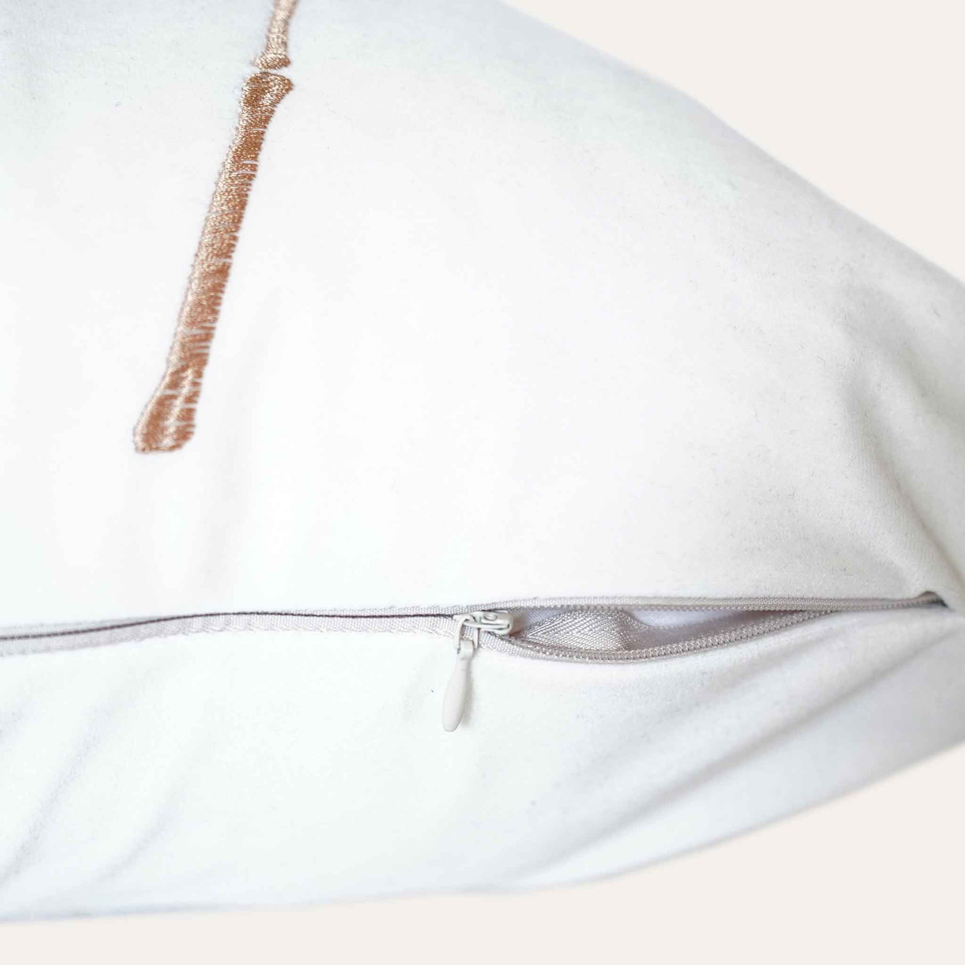 Elegant gold bamboo embroidered white cushion cover with invisible zipper.