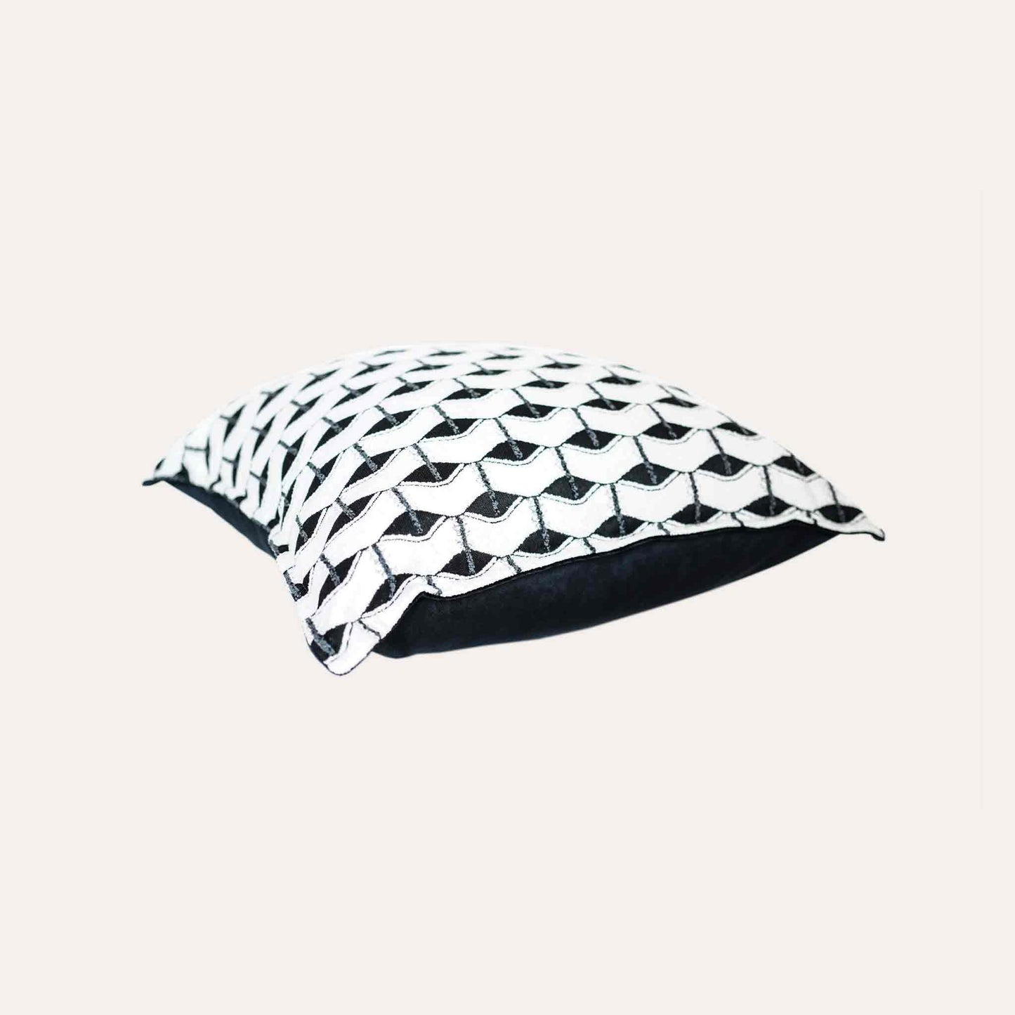 Chic black and white geometric cushion cover.