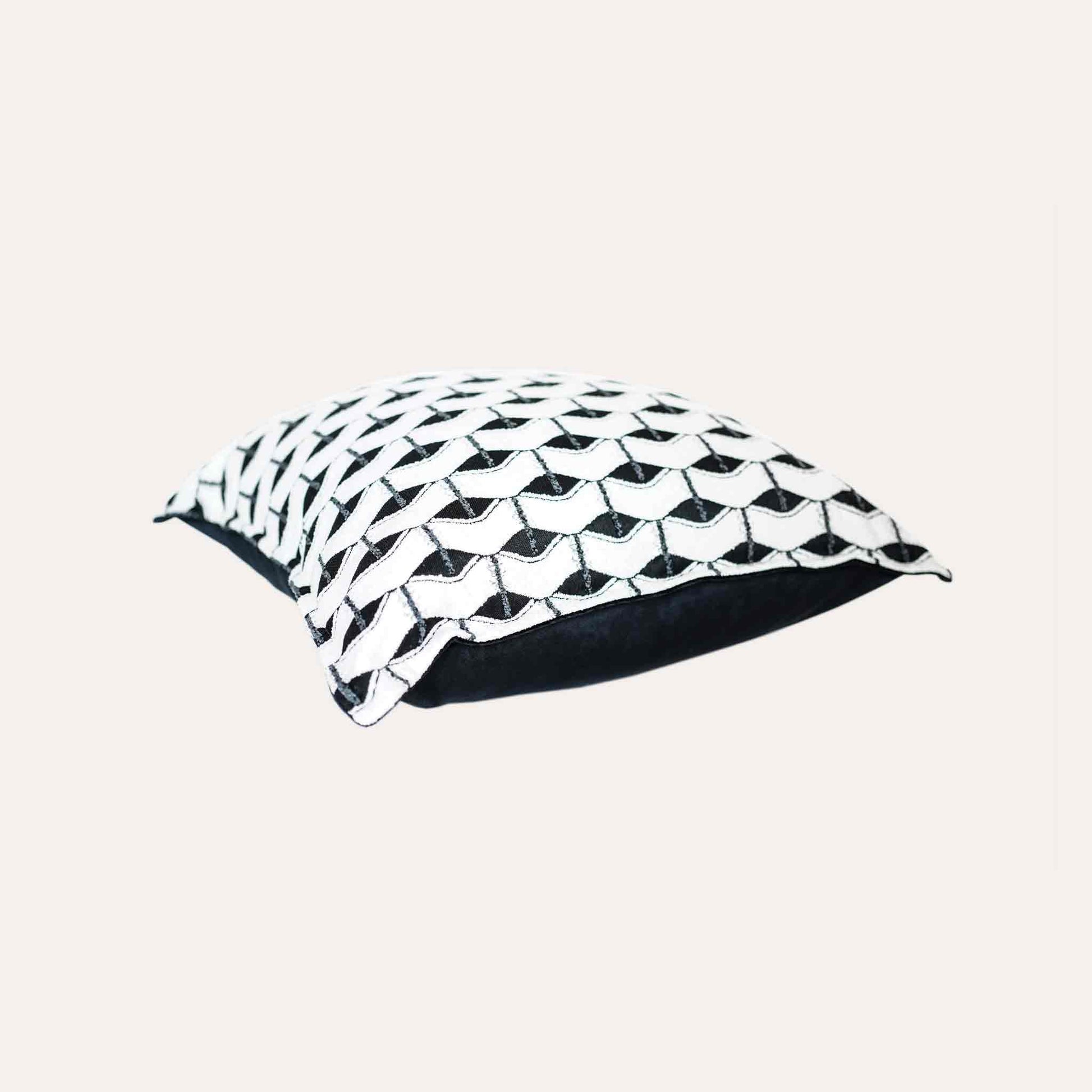 Chic black and white geometric cushion cover.
