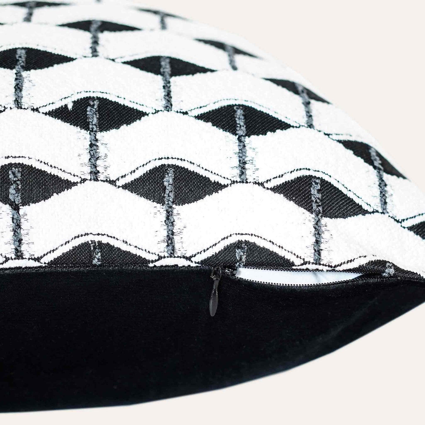 Chic black and white geometric cushion cover with invisible zipper.