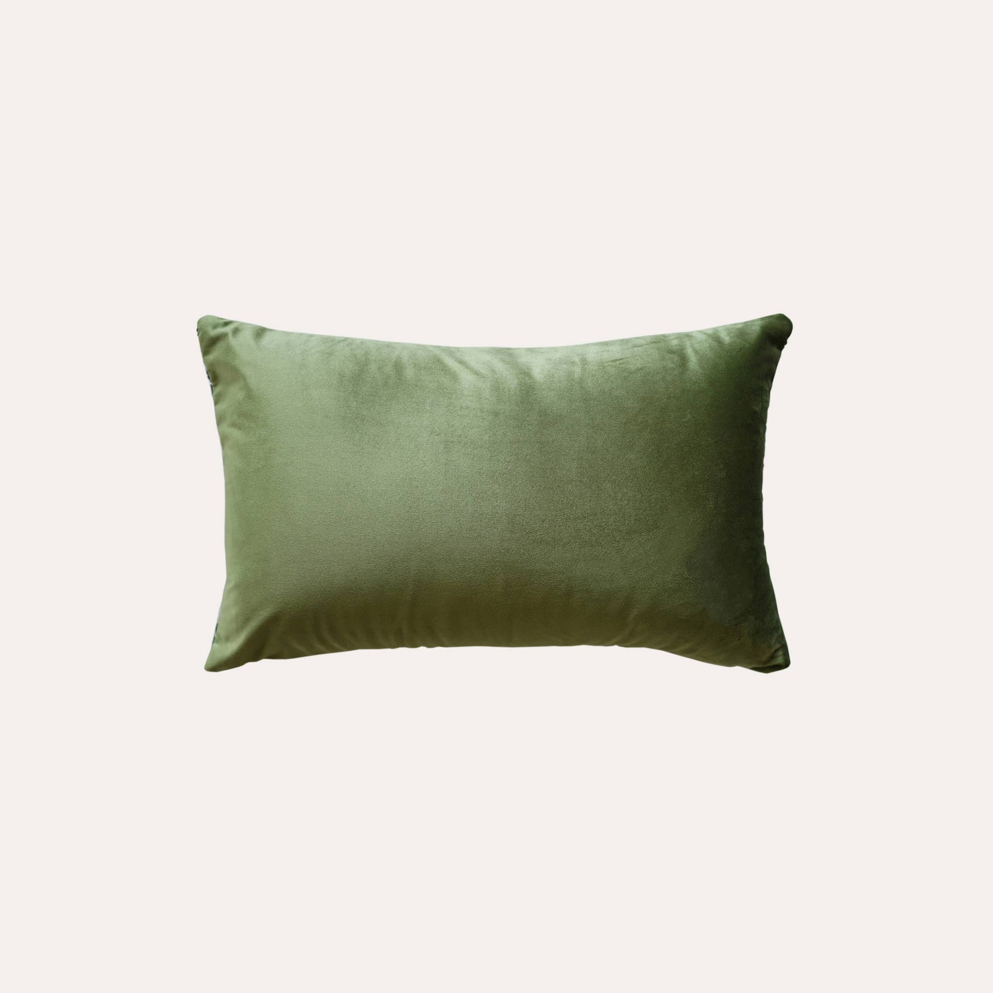 Stylish green and white geometric cushion cover with solid green back.