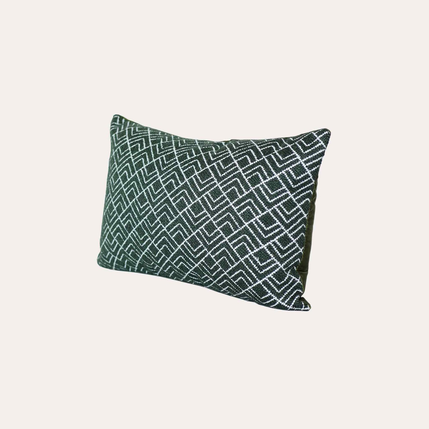 A stylish green and white geometric pattern cushion cover ideal for modern home decor.